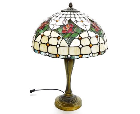 A Tiffany style table lamp, with cream rose shade, on a rubbed gilt impression base, 51cm high.