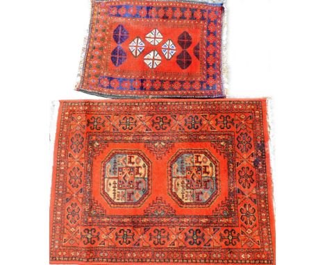 Two middle Eastern prayer rugs, to include one with stag and medallion border and Greek key surround, 50cm x 62cm, together w