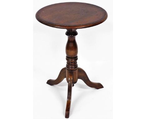 An early 19thC mahogany tripod table, the circular top above tripod base, 71cm, 50cm diameter. 