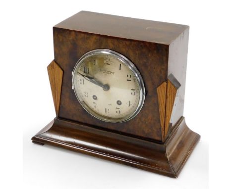 A Bravingtons Renown Art Deco style walnut mantel clock, with two colour walnut panelling and silvered dial, 24cm high, 26cm 