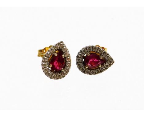A pair of 18ct gold ruby and diamond earring, each earring set with a pear cut ruby surrounded by pavé set tiny diamonds, in 