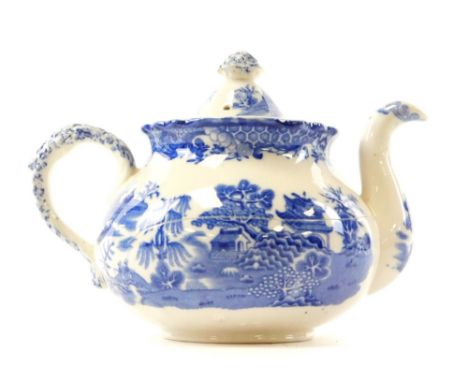 A Royal Worcester blue and white teapot, with floral finial, shaped spout and floral handle, stamp to underside, 13cm high. 