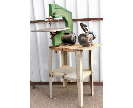 A workshop bench with various tools, to include a band saw and a bench grinder NTG6l-4.Buyer Note: WARNING! This lot contains