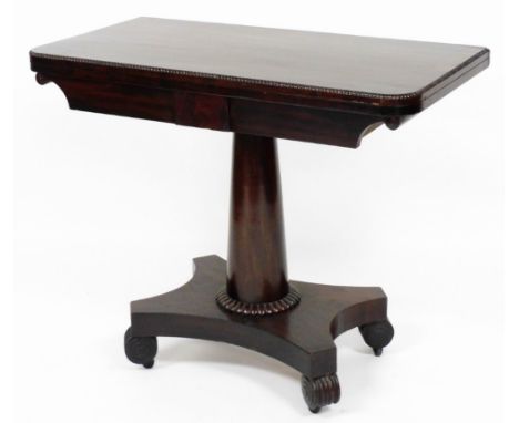 A William IV mahogany card table, with fret work border opening to reveal a green lined interior, on scroll feet with castors