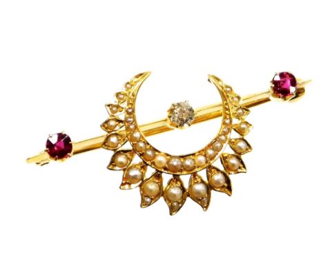 An Eastern inspired bar brooch, set with diamond, ruby and applied crescent moon and flower set seed pearl surround, the old 