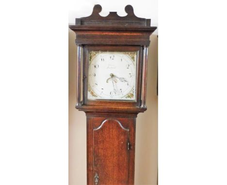 Cavit of Bedford. An early 19thC oak longcase clock, the square painted cream dial with floral decoration and an oak shaped p
