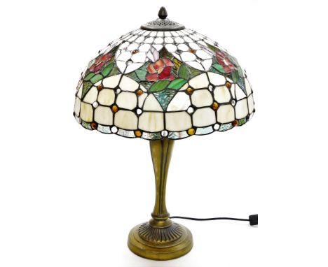 A Tiffany style table lamp, with cream rose shade, on a rubbed gilt impression base, 51cm high.