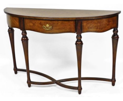 A mahogany finish console table, with curved front, on x frame curved base, 77cm high, 95cm wide, 35cm deep. 