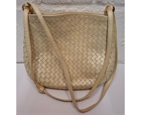 Bottega Veneta- A vintage pearlised cream shoulder bag with signature Intrecciato weave,, 2 internal compartments, gold brand