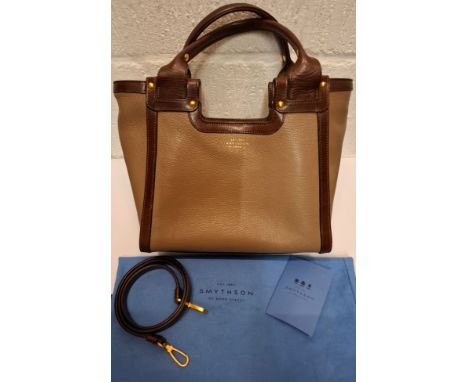 Smythson-A brown leather handbag approx 13" wide x 10" high having twin handles, detachable shoulder strap, blue branded dust
