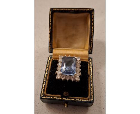 A Ciro large blue topaz ring surrounded by cubic zirconias set in a rhodium plated mount. Location:If there is no condition r