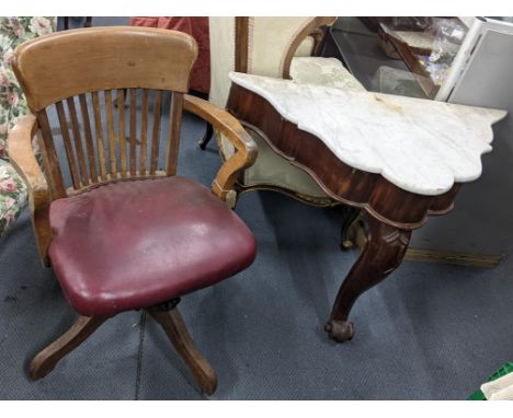 A late 19th century mahogany and marble top console table together with a captain's swivel armchairLocation:If there is no co
