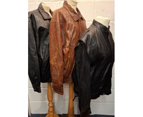 A group of vintage leather jackets comprising a Wilsons black soft leather jacket, size Large, having a front zip closure and