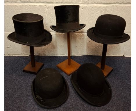 A group of gents vintage hats to include a Dunn & Co black top hat A/F, an Extra Best Quality top hat A/F and 3 black bowler 