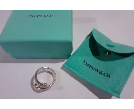 Tiffany & Co- A silver Elsa Peretti ring with branded turquoise box and envelope dust bag. Location:If there is no condition 