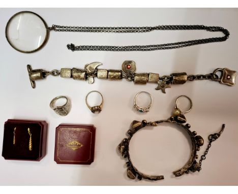 A quantity of mainly modern silver and silver tone costume jewellery to include a Danon silver tone charm bracelet, a white m
