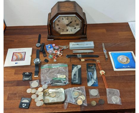 A mixed lot to include an Art Deco style mantel clock with an octagonal shaped dial, commemorative coins, gents wristwatches 