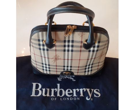 Burberrys- A vintage Haymarket check and black leather Alma handbag, made in Italy, having gold tone hardware, a full length 