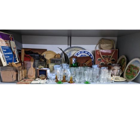 A mixed lot to include kitchenalia, bread knives and a bread board, vintage handbags, Indian reproduction brass marching comp