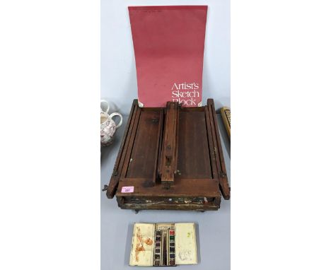 A vintage artist folding easel with drawer along with a sketch pad and used Reeves artists colours box, and a bagatelle board