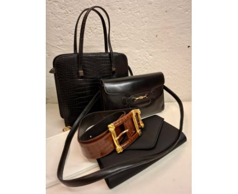 A group of vintage leather bags to include a black faux snakeskin handbag, an Italian black leather shoulder bag with gold to