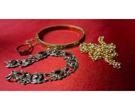 A small quantity of vintage costume jewellery to include an engraved rolled gold hinged bangle with safety chain, 13.8g, a 9c