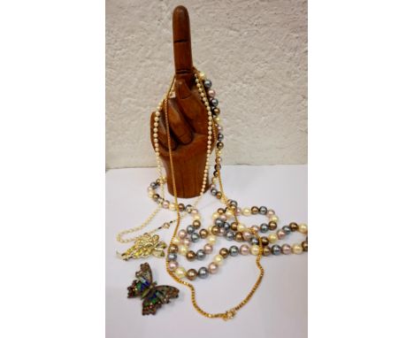A small quantity of jewellery to include a string of pearls with 9ct gold clasp stamped 375, a gold tone necklace and a white