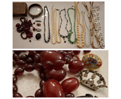 A small group of vintage costume jewellery to include a gold tone mosaic brooch, an Aurora Borealis necklace, an iridescent h