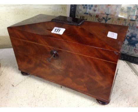 A 19th century mahogany tea caddy with fitted interior (glass bowl not original).