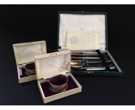 A cased set of six silver handled bread and butter knives together with a Victorian silver spoon and a pair of engine turned 