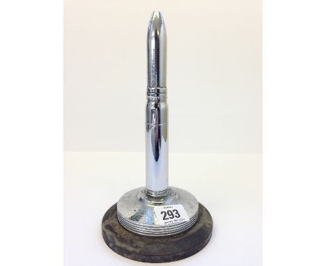 A WW2 chrome plated nickel bullet shaped table top cigarette lighter, dated 1942. ( In the style of Dunhill )