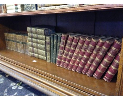 A shelf of thirty five various sets of 19th century and other French leather bound volumes and books including Sainte-Beuve, 