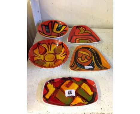 Five various Poole Pottery Delphis bowls and trays.