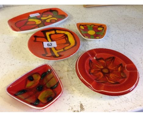 Four various small Poole Pottery Delphis pin trays and an ashtray (five).