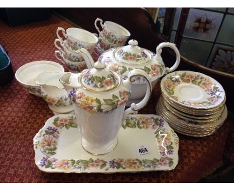 A Paragon bone china tea service, decorated in the Country Lane pattern, complete for six including teapot and hot water jug.