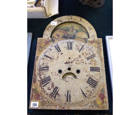 An 18th century painted metal longcase clock face with revolving sun and moon feature.
