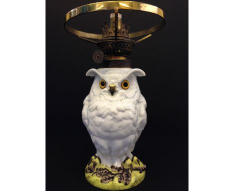 A late 19th/early 20th century French porcelain Owl shaped oil lamp base with glass eyes on circular oak leaf base, printed m