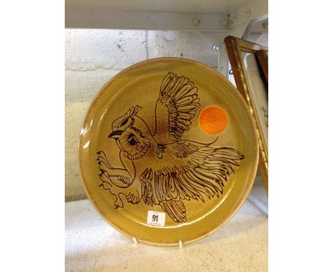 A Poole Pottery Aegean plate, decorated by L J Wills in an Owl and Sun design.