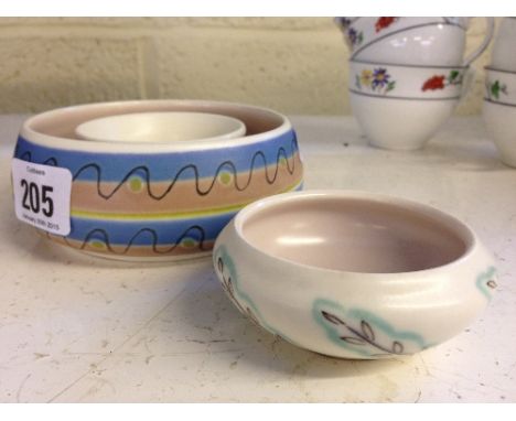 A Poole Pottery Freeform posy ring, decorated in the TNB pattern together with a miniature bowl.