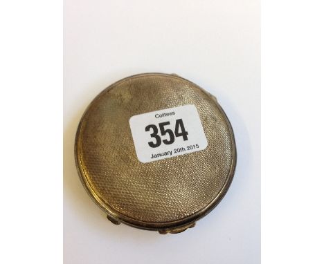 An engine turned silver ladies' compact (69 grams overall).