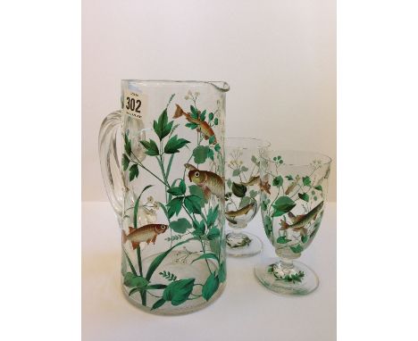 An early 20th century Moser style enamel decorated glass Lemonade jug with all-over fish and reed decoration (small fracture 