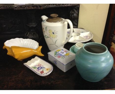 Nine various Poole Pottery items.