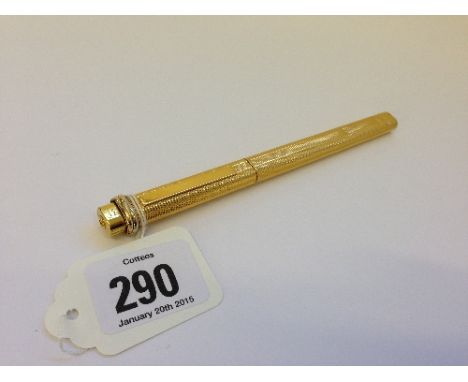 A Cartier engine turned gold plate cased ballpoint pen (minor dents).