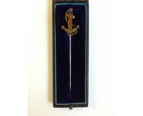 A Victorian gold stick pin with Scottish hard stone mounted anchor mount in original velvet lined leather case.