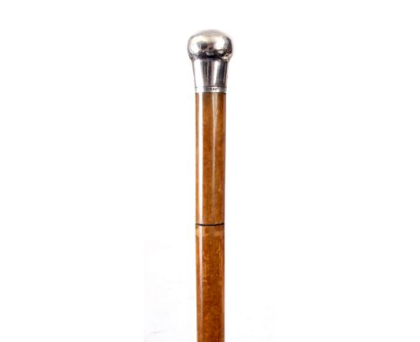 AN EARLY 19TH CENTURY MALACCA SILVER MOUNTED SWORD STICK with engraved steel blade and plain silver top 94cm high.ConditionTh