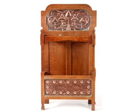 A STYLISH ART NOUVEAU OAK STICK STAND with stylised&nbsp;hammered copper panels 95cm high 54cm wide.