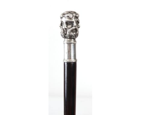 AN EARLY 20th CENTURY SILVER METAL HANDLED WALKING CANE FORMED AS THE FACES OF SIX GREEK GODS, possible Zeus and son Apollo o
