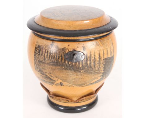 A MID 19TH CENTURY GERMAN FRUITWOOD CYLINDRICAL TEA CADDY with Stencil engraved decoration of a humorous scene&nbsp;and town 