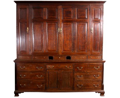 A GEORGE III MAHOGANY&nbsp;CROSS-BANDED FIGURED OAK COUNTRY HOUSE KEEPERS CUPBOARD with moulded edge above a cupboard top wit