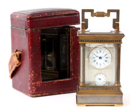 A LATE 19TH CENTURY FRENCH MINIATURE CARRIAGE CLOCK the silvered and gilt case with turned columns to all four corners on ste